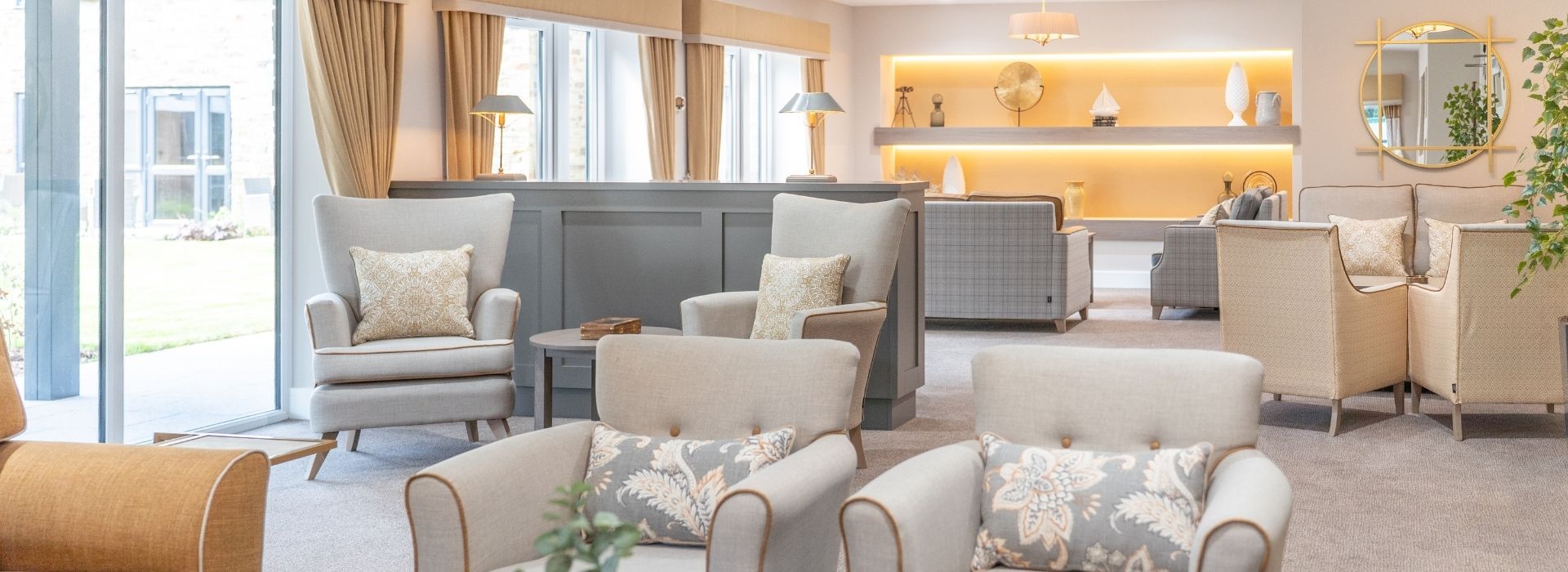 A cozy living room featuring comfortable chairs and sofas