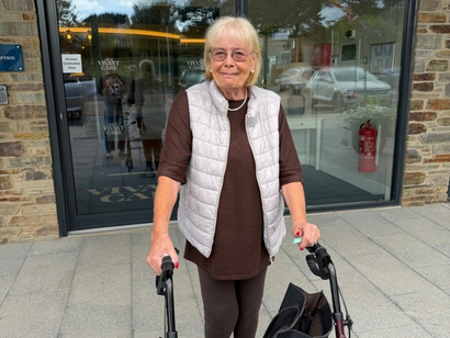 A female resident stood outside the front of Bayards Court smiling
